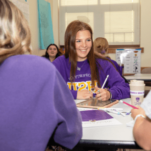 Female Student taking notes in class